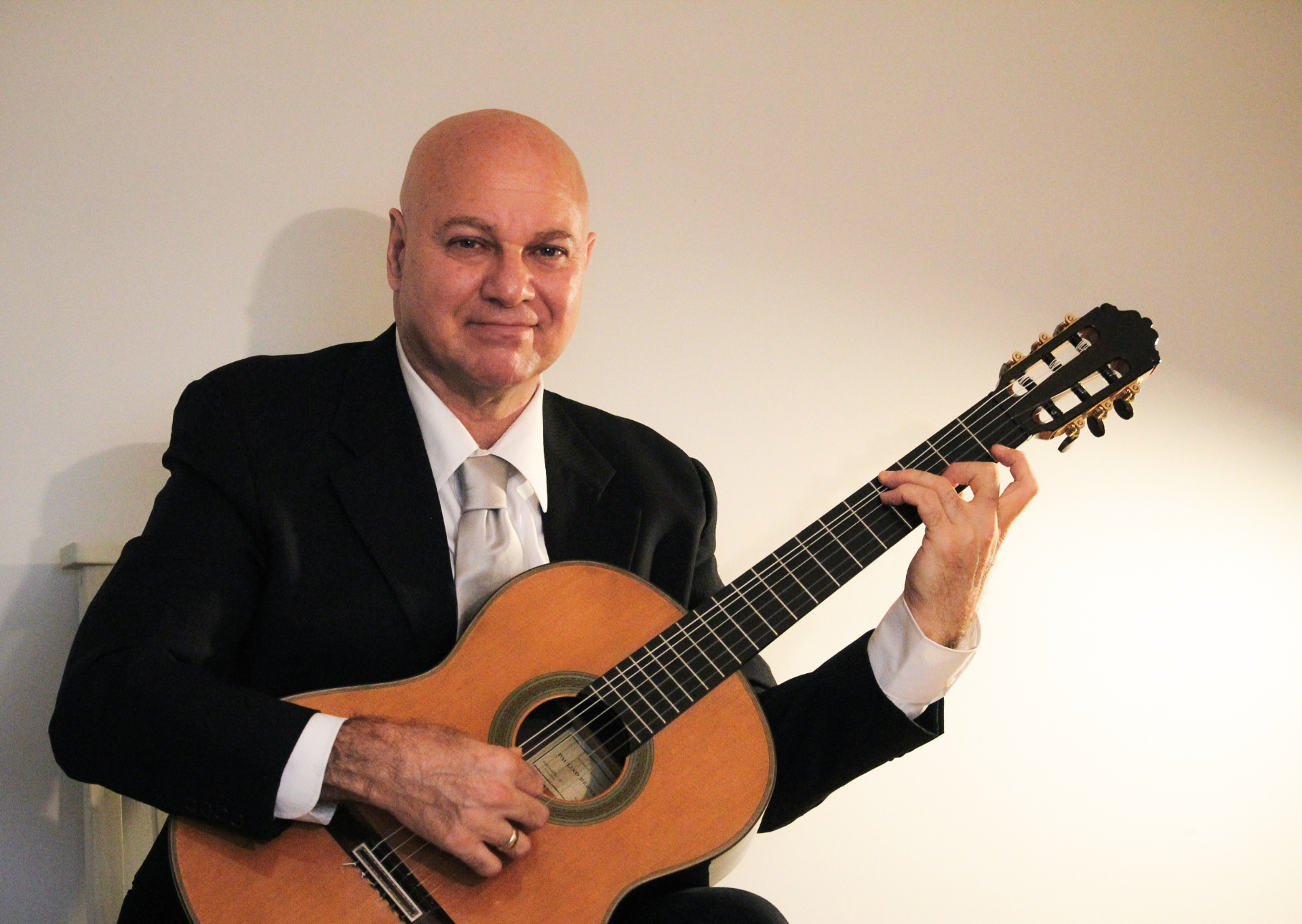 Marc Anthony Tucciarone performing in formal attire